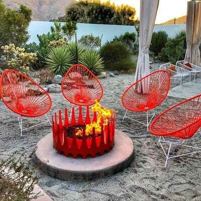 Red chair outdoor gathering with Cayenne color natural gas burning Royalfire- modfire outdoor fireplace