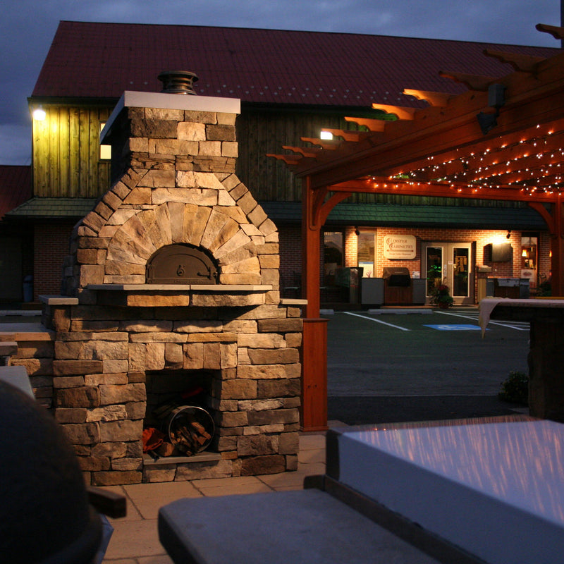 Brick outdoor Wood Gas Hybrid pizza oven with wood storage on a patio outdoor kitchen setup ready to make your perfect outdoor kitchen. CBO 750 Hybrid Pizza Oven, dual fuel pizza oven, outdoor wood fired pizza oven, natural gas pizza oven, DIY pizza oven kit, residential countertop pizza oven, Chicago Brick Oven, backyard pizza oven, outdoor kitchen pizza oven, hybrid pizza oven for home. Alfa Pizza Oven 3 pizze but better made in America with built in Gas BBQ LPG NG Pizza Oven Wood Burning Ooni Gozney