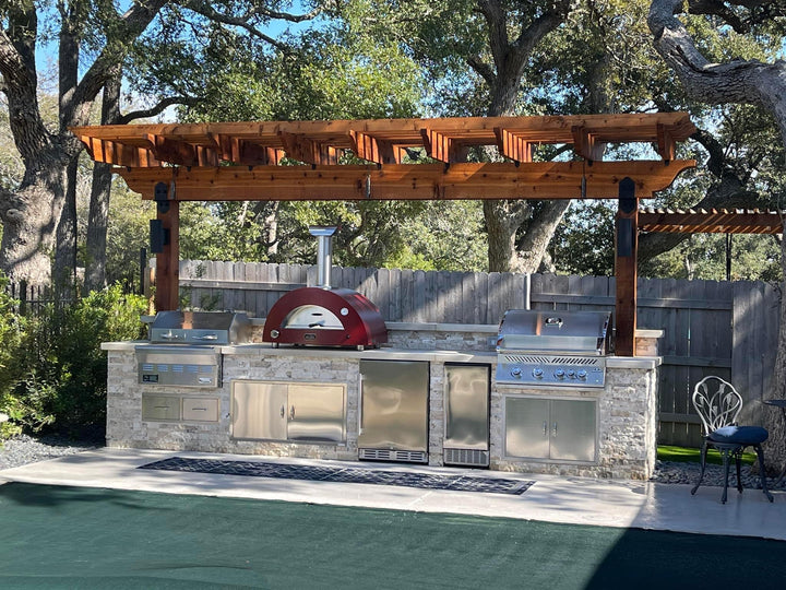 Complete your outdoor kitchen with the top of the line Hybrid Pizza Oven - 3 pizze is Commercial quality but custom built to withstand the outdoors. this one sits under a beautiful pergola shade cover with the pool at your feet