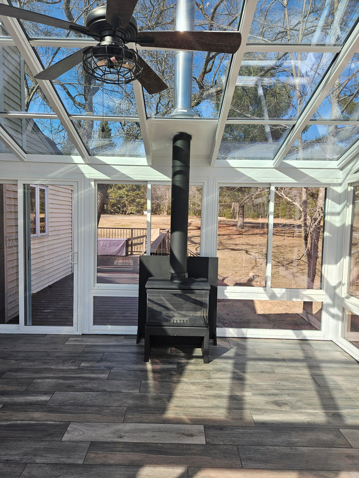 Actual Customer Photo from a Beautiful glass room in Wisconsin - This Sunroom is perfect for the 3 sided glass fireplace. Multi Sided See through Direct Vent or Wood Burning Fireplace
