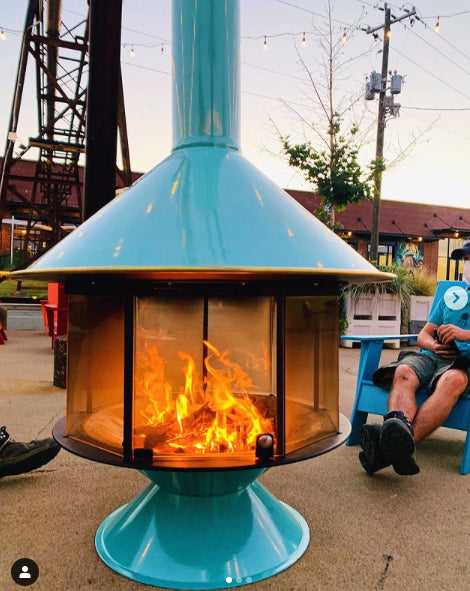 Turquoise Malm MCM Fireplace is an indoor outdoor fireplace that brings elegance and style to the room or patio. this is a great patio heater. it can be supplemented by the Bromic patio heater as well. This here is the wood Burning MALM MCM