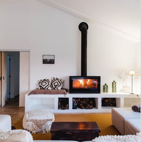 Living room installed Black Stuv 16 cube with Burning wood