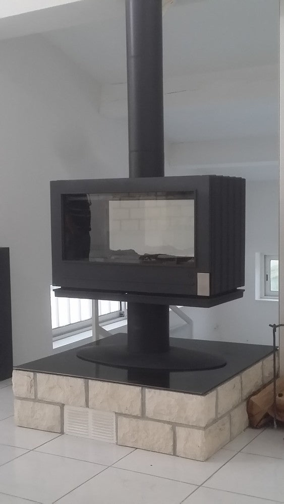 elevated Glass Fireplace with a modern French design. This see through design allows the room to stay open