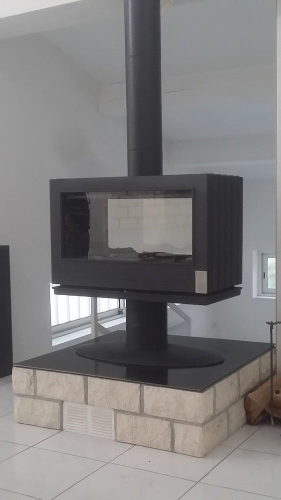 elevated Glass Fireplace with a modern French design. This see through design allows the room to stay open 