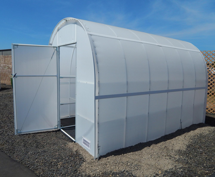 Outside view of 8' X 12' solexx gardeners Oasis outdoor greenhouse with open closeable door 