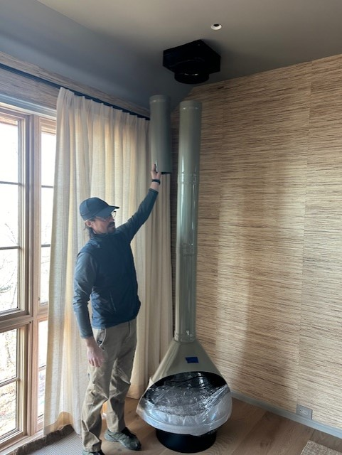 this is a freshly installed 30" Grey Porcelain malm- in this case the Chimney flue was installed backwards and simply flipped. so they put the flue inside for a telescoping style and it clicks right in 