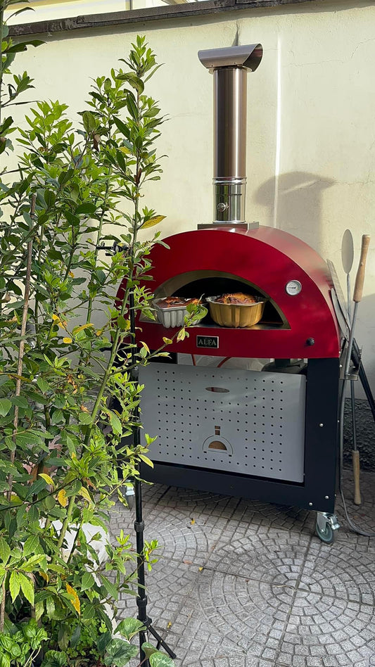 This is the LOW AND SLOW BAKING SYSTEM FOR THE ALFA 2 PIZZE Outdoor Wood Pizza cooking with Italian Flair. This the Alfa Ciao on top the the large prep table. The True Italian pizza oven the Alfa Forno Ciao is a wood fired pizza oven for the backyard pizza enthusiast. This pizza oven you can add the cart, legs or just use your own backyard table. the base does not get too hot to be put on wood.
