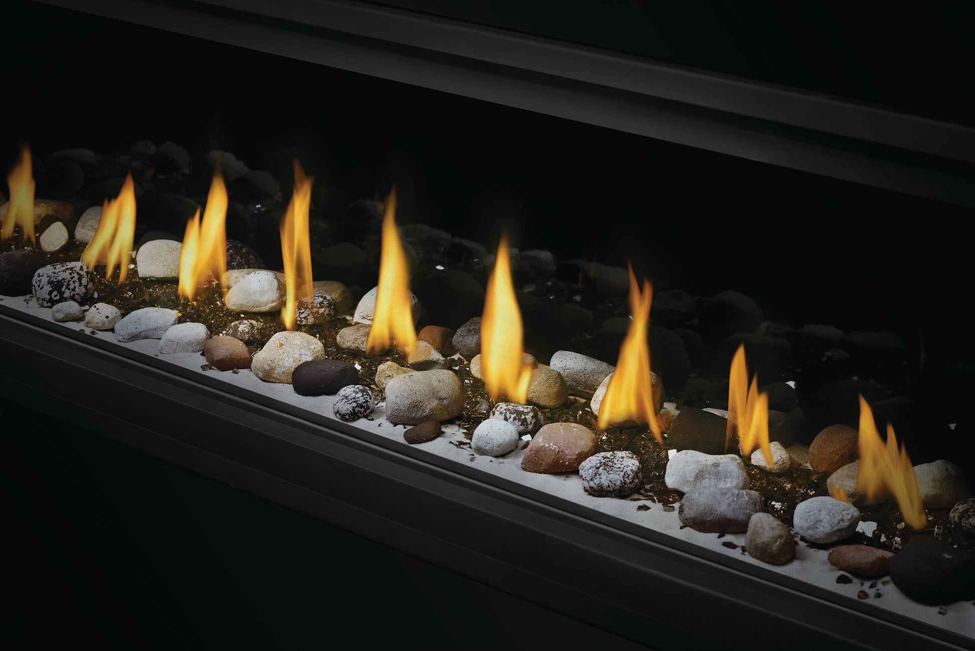 Napoleon's Luxuria 74 See-Through linear gas fireplace provides an unobstructed view of the contemporary linear fire and requires no safety screen. The safe-to-touch, triple-pane Glass Guard system, and Dynamic Heat Control provide safe heating and beautiful views to two rooms at once. Versatile installation opportunities allow for TVs and artwork to safely be displayed above the fireplace while combustible materials are installed flush with the opening. Include premium media options like Nickel Stix, Miner