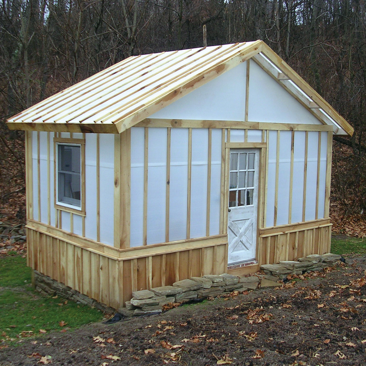 A house covered with solexx greenhouse plastic sheet roll