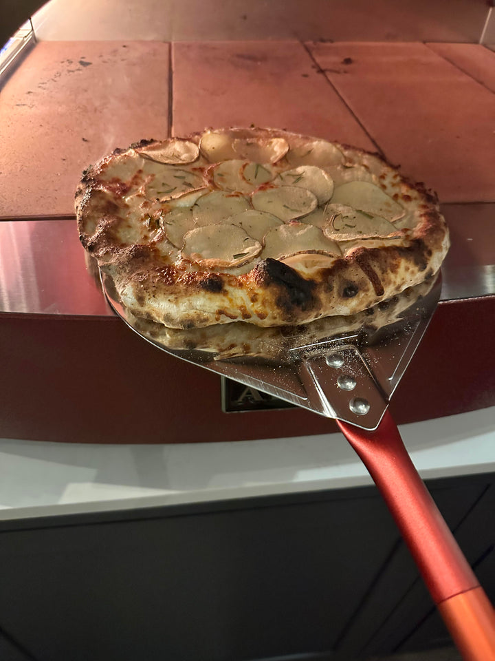 Red Alfa Pizza Peel in Action ! thank you to our customer for this submitted photo