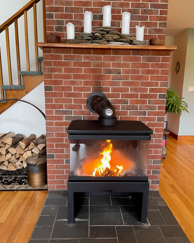 three sided glass wood fireplace. see through sides on this wood fireplace for an open angle view of your fire.