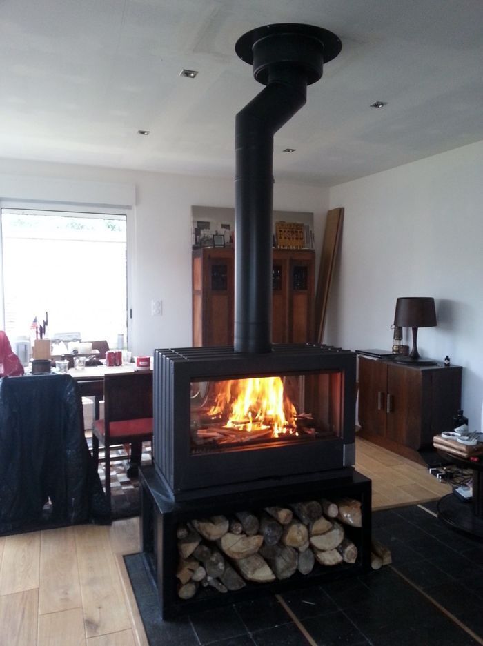 Wood Storage under the see Through double sided glass fireplace