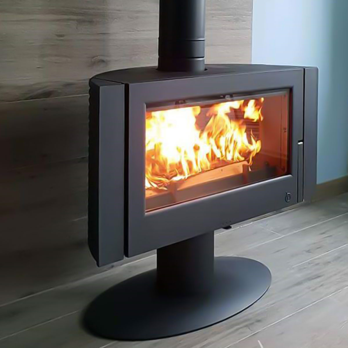 Vented Modern Wood Stove with Glass Door and pedestal the Invicta Antaya and Itaya are perfect for your open living room or large home or cabin. pushing almost 1000 BTU's they will heat over 2500 SF