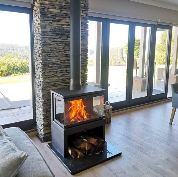 This is the Live view of our KFD 3 sided wide angle wood fireplace. This is a open room fireplace with the pedestal included with wood holder below. 