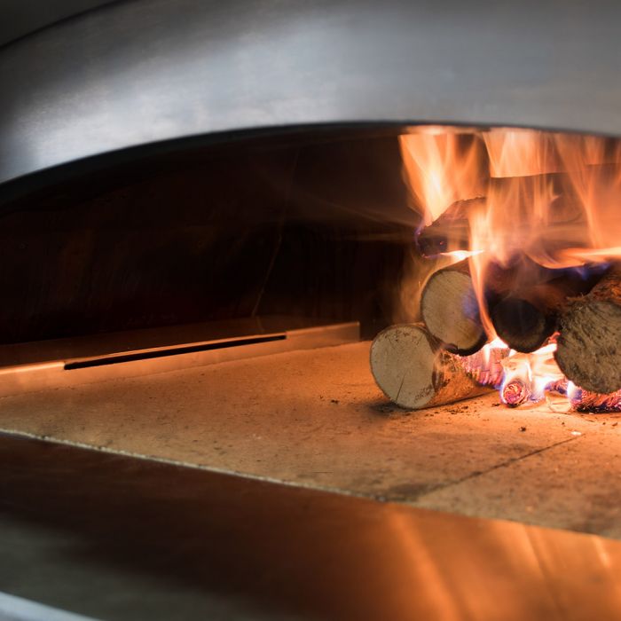 Alfa Hybrid Kit for gas Pizza ovens- this holds the wood for better heat distribution and air flow.. while there is a cover that will cover and protect your gas burners from the ash and wood